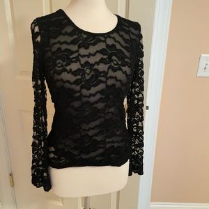 Black lace top with a lining so no problem with see through issues.
